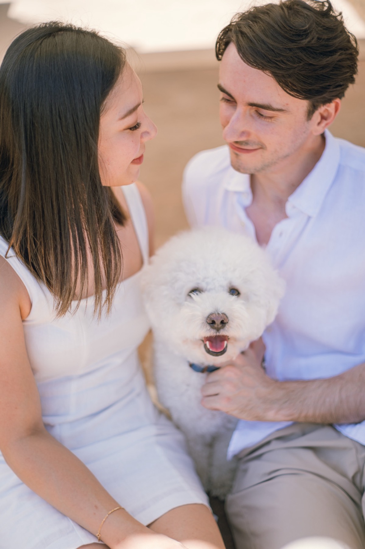 The couple looking at each other lovingly, Marlo grinning between them